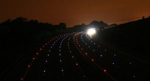 LED Cats-eyes along the M25 at dusk, marking out the road limits.